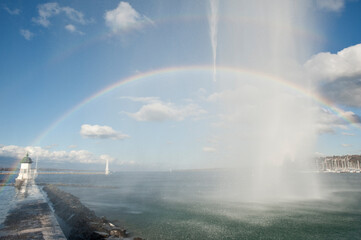 beautiful rainbow on the pier and the water jet in Geneva Switzerland