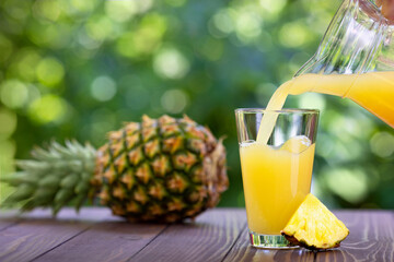 pineapple juice pouring into glass