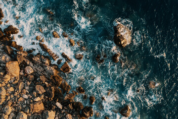 Beach and waves top view. Turquoise water background aerial view. Summer seascape from air. Top view from drone. Travel concept idea