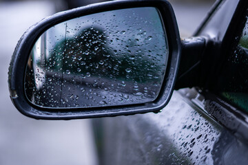 wet car wing mirror
