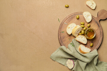 Fototapeta na wymiar Jar of tasty olive oil and bread on color background
