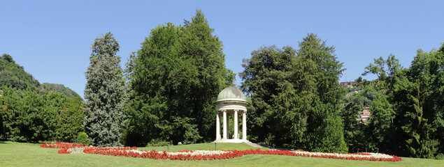 parco con fiori e gazebo di marmo a como in italia, park with flowers and marble gazebo in Como in...