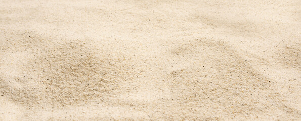 Fototapeta na wymiar Fine white sand texture on beach Fine white sand texture on beach. Close-up with short depth of field and space for text. Horizontal background for a tourism concept. Space for text.