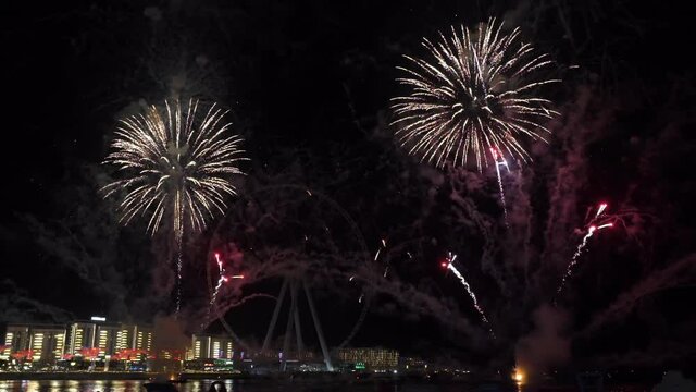 fireworks in Dubai on a background of bluewaters. water chanal