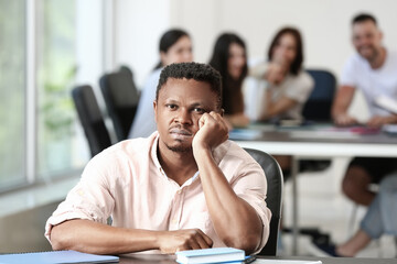 Lonely African-American man in office. Stop racism