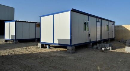 Portacabin, porta cabin, temporary labours camp , Mobile building in industrial site or office container Portable house and office cabins. Labor Camp. Porta cabin. small temporary houses