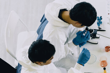 Lab Technician in Personal protective equipment  PPE suit Vaccines testing of Virus