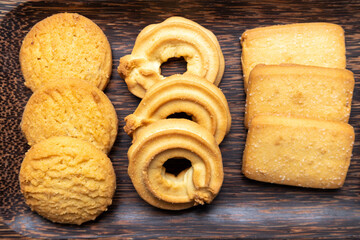 Cookies in a wooden plate on wooden table
