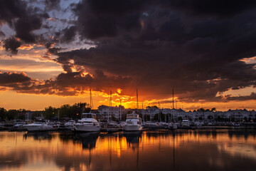 pleasure boats in Cobourg docks in dramatic sunset Cobourg Ontario Canada