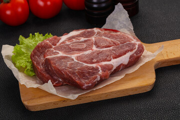 Raw pork neck steak