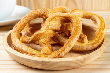 pretzels on wood table and black coffee