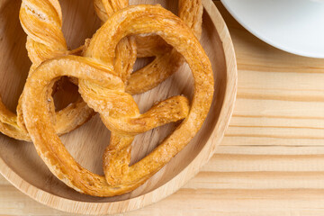 pretzels on wood table and black coffee