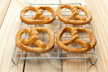 pretzels on wood table and black coffee