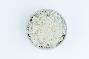 Rice in a cup is isolated.