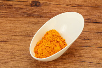 Tumeric powder in the bowl