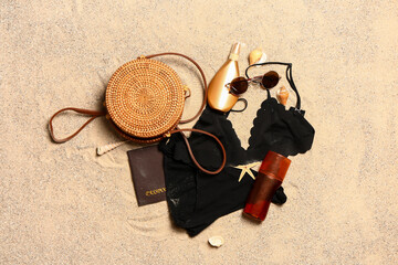 Set of beach accessories on sand, top view