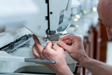 Fabric industry production line. Textile factory. Working tailoring process