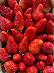 Wooden box with strawberries. View from above