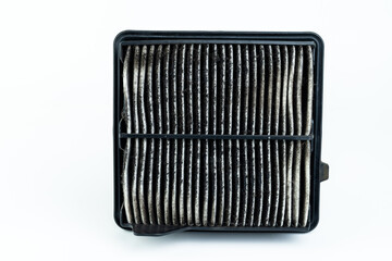 Close up dirty car air conditioner filter isolated on white - deep focus image.