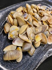 Traditional Spanish dish - tellinas, clams with garlic. National Mediterranean cuisine