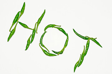 Fresh harvested green chili on white background.