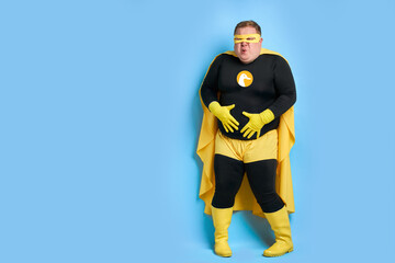 young superhero fat man needs a toilet, man has stomach ache or diarrhea, man emotionally reacts,...