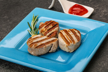 Grilled pork medallion with sauce