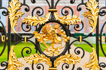 Kensington Palace gates with close ups of the gold leaf motifs on the gate