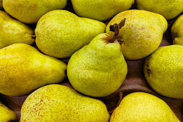 Pears are green. View from above. Juicy and delicious fruit. A source of vitamins and minerals.