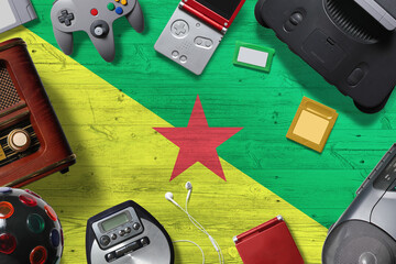 French Guiana retro gaming concept. A collection of retro video game controllers shot from above on...