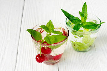 Fresh cool drink of ripe juicy cherry and gooseberry berries