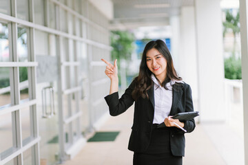 Beautiful young asian woman  holding tablet pc