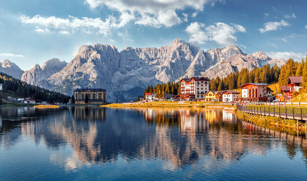 Amazing tourquise Misurina lake with perfect sky reflection in calm water. Stunning view on the majestic Dolomites Alp Mountains, Italy, National Park Tre Cime di Lavaredo, Dolomiti Alps, Tyrol