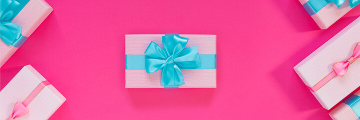 Banner from set of beautiful gift boxes with blue bows on pink background. Holiday sale.