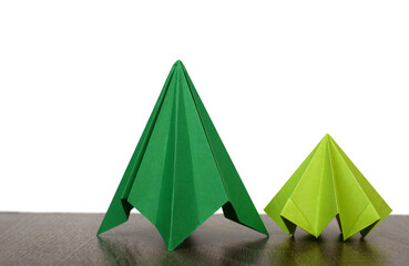 two origami christmas trees on white