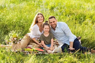 Happy family spending time together on a picnic outdoor