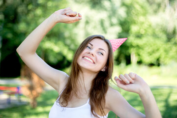 ?ortrait of a cheerful happy young girl student dancing during the coronavirus pandemic against of...