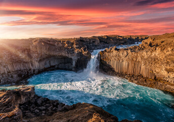 Wonderful Sunny landscape. Impressively beautiful nature of Iceland during sunset. Aldeyjarfoss waterfall in North-Iceland. Awesome tourist attraction. Exciting icelandic scenery.