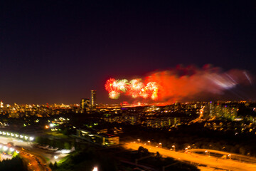 Fototapeta na wymiar festive color fireworks in the big city in the evening