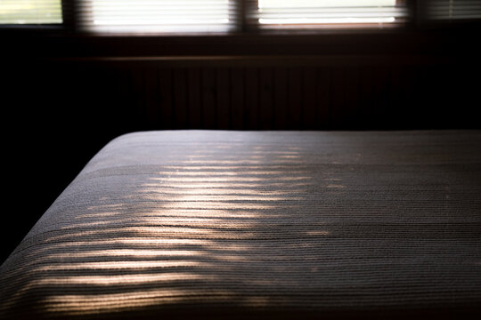 Morning light on bedspread