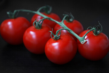 red tomatoes on a black