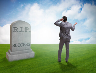 Businessman mourning the death of success