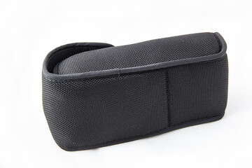 Naklejka premium The back of a black external camera flash light cover, on a white background.