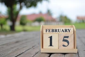 February 15, Number cube with a natural background.