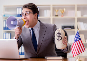 Businessman with American flag in office