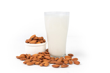 Close Up glass of Almond milk with Almond seeds.  on white background