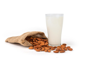 Close Up glass of Almond milk with Almond seeds.  on white background
