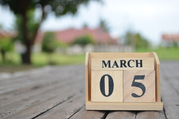 March 5, Number cube with a natural background.