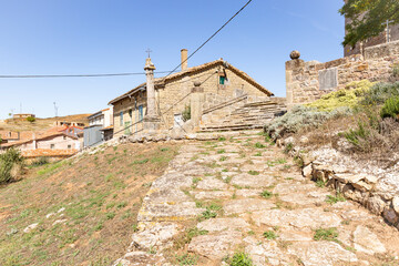 a stone path and stairs to the church in Revilla del Campo town, province of Burgos, Castile and Leon, Spain