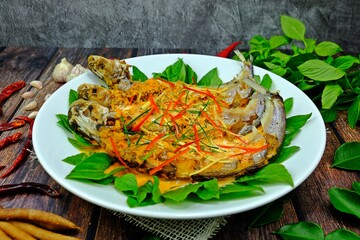 Deep fried Sheatfishes with red curry paste. Authentic Thai food.